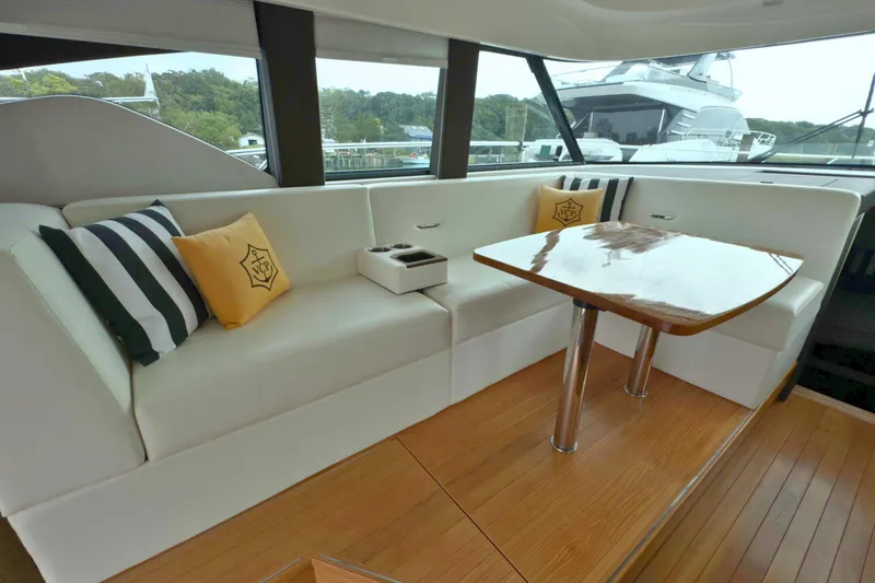 Slide: The Image of Luxurious interior of 2018 Tiara Yachts C44 Coupe with elegant seating and wooden table. - 31