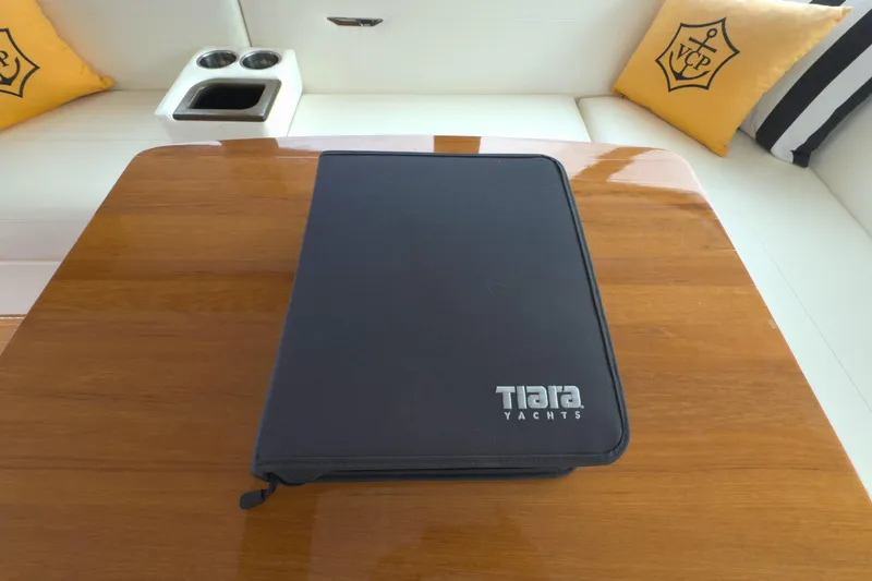 Slide: The Image of Tiara Yachts folder on wooden table, 2018 C44 Coupe interior. - 38