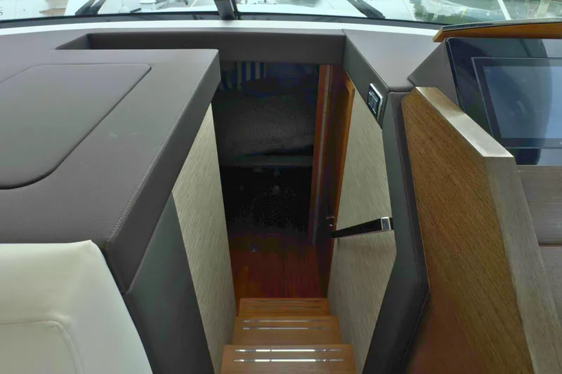 Slide: The Image of Interior view of 2018 Tiara Yachts C44 Coupe, featuring cabin stairs and modern design. - 39