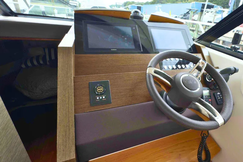 Slide: The Image of 2018 Tiara Yachts C44 Coupe helm with modern controls and dual displays. - 40