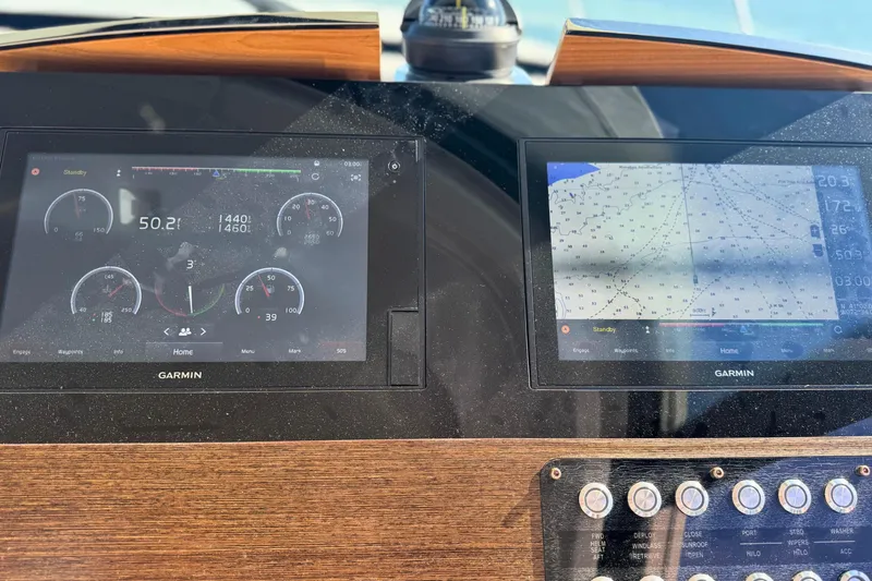 Slide: The Image of Dashboard of 2018 Tiara Yachts C44 Coupe with Garmin navigation displays. - 42