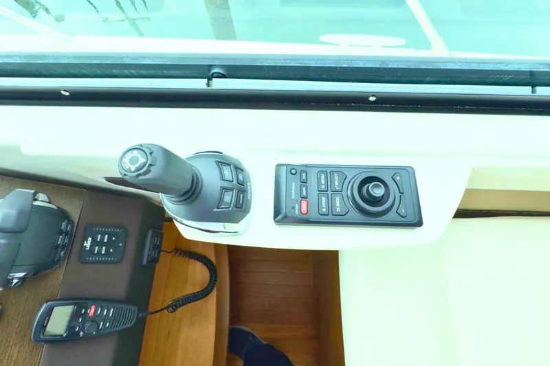 Slide: The Image of Control panel of 2018 Tiara Yachts C44 Coupe with joystick and communication device. - 44