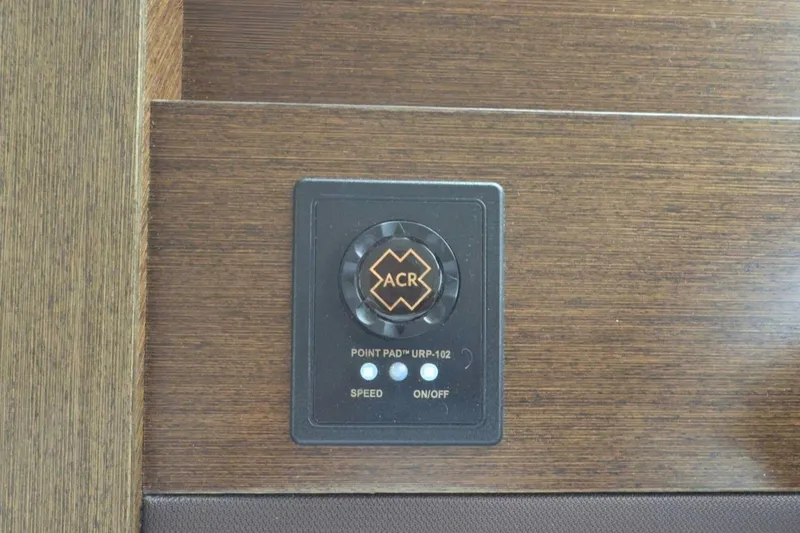 Slide: The Image of Control panel on 2018 Tiara Yachts C44 Coupe with wood finish and ACR switch. - 45