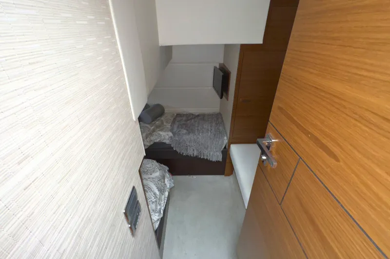Slide: The Image of 2018 Tiara Yachts C44 Coupe bathroom with modern fixtures and wooden accents. - 52