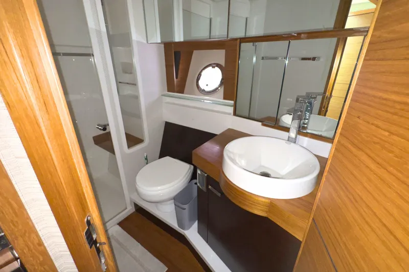 Slide: The Image of Luxurious cabin interior of 2018 Tiara Yachts C44 Coupe with elegant bedding. - 56