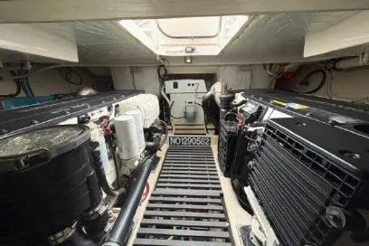 Slide: The Image of Engine room of 2018 Tiara Yachts C44 Coupe, showcasing mechanical components and equipment. - 60