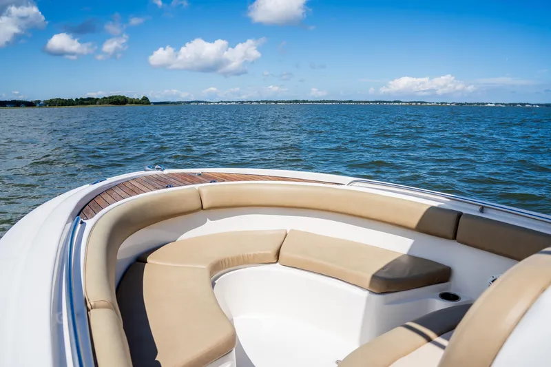 Slide: The Image of 2007 Chris-Craft Catalina 23 boat on open water with clear blue sky. - 14