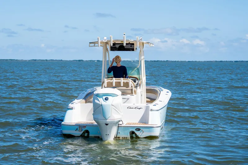Slide: The Image of 2007 Chris-Craft Catalina 23 boat on open water, rear view. - 3