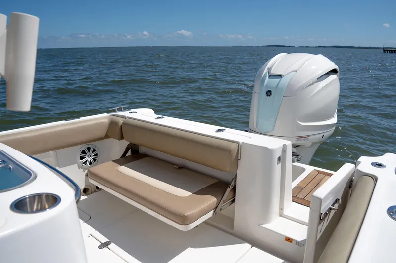 Slide: The Image of 2007 Chris-Craft Catalina 23 boat interior with seating and outboard motor on open water. - 6