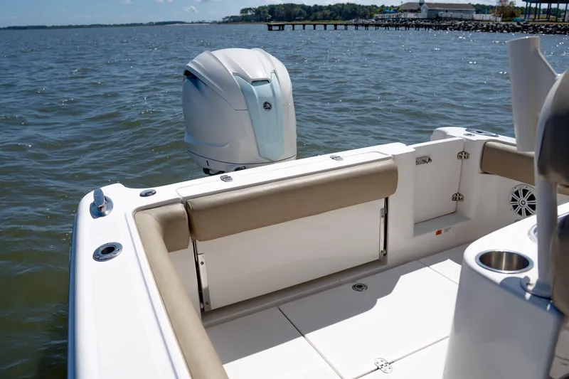 Slide: The Image of 2007 Chris-Craft Catalina 23 boat interior with outboard motor on calm water. - 7