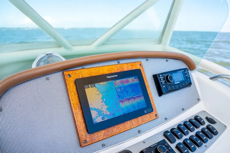 Slide: The Image of Dashboard of 2007 Chris-Craft Catalina 23 with navigation and control systems. - 9