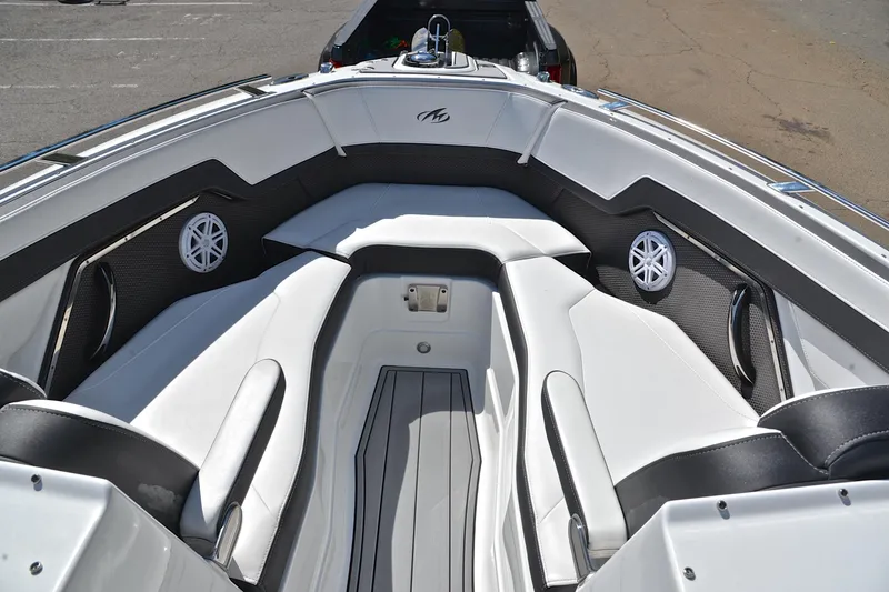 Slide: The Image of 2023 Monterey 275SS Super Sport boat interior with white seating and speakers. - 21