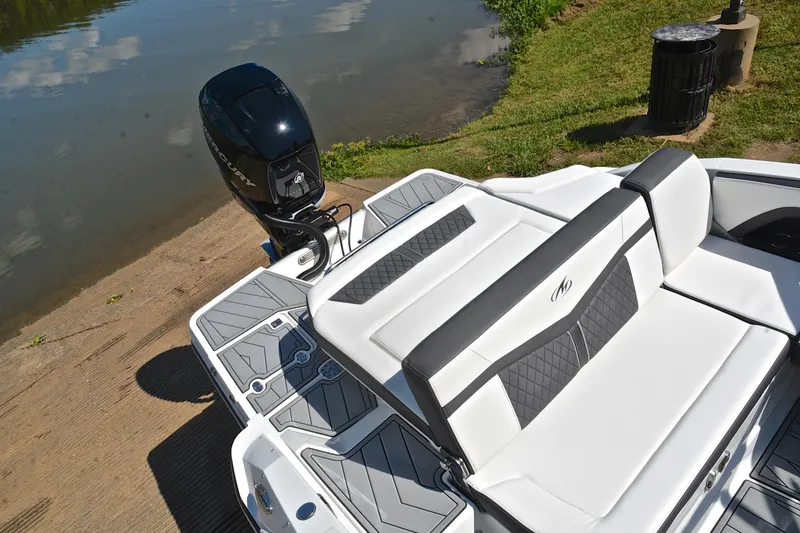 Slide: The Image of 2023 Monterey 275SS Super Sport boat with sleek seating and powerful outboard motor. - 23