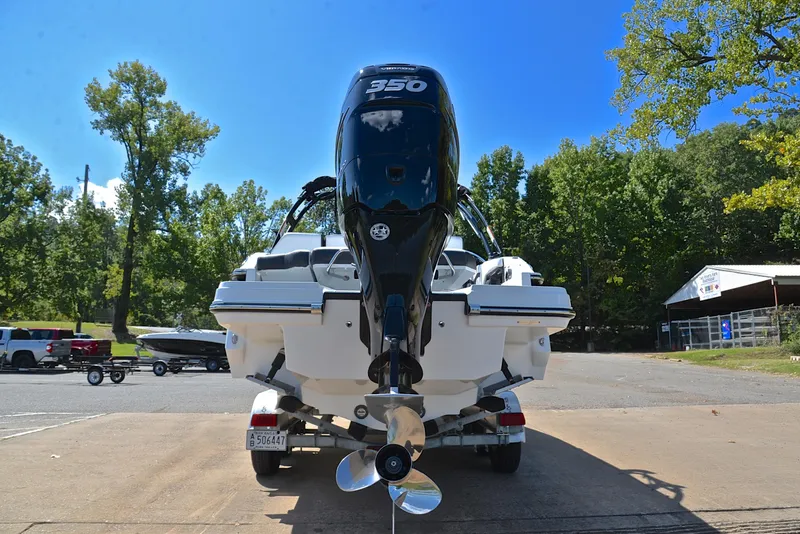 Slide: The Image of 2023 Monterey 275SS Super Sport boat with powerful outboard motor, parked on a sunny day. - 30