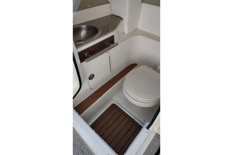 Slide: The Image of 2014 Sea Ray 270 SLX boat bathroom with sink and toilet. - 15