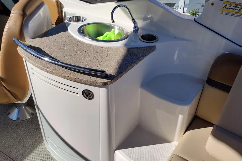 Slide: The Image of 2014 Sea Ray 270 SLX boat interior with sink and countertop. - 18