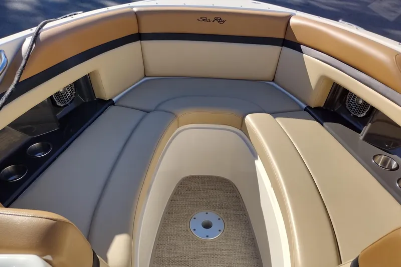 Slide: The Image of 2014 Sea Ray 270 SLX boat interior with tan seating and cup holders. - 20