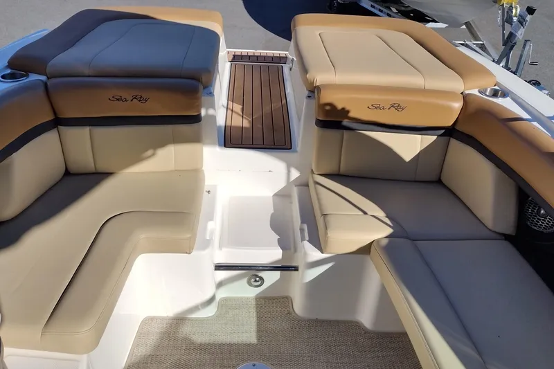 Slide: The Image of 2014 Sea Ray 270 SLX boat interior with tan leather seating and wood accents. - 24