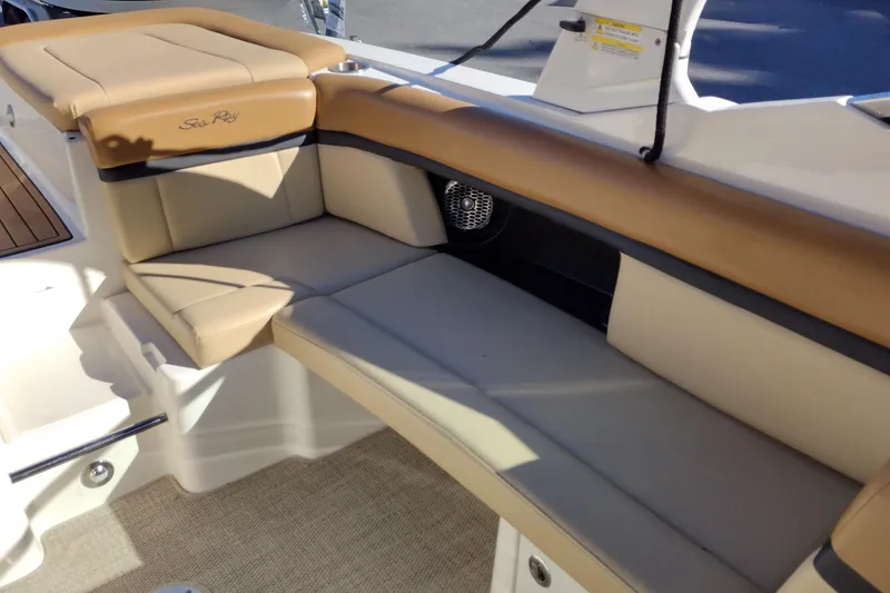 Slide: The Image of 2014 Sea Ray 270 SLX boat interior with tan leather seating and speaker. - 25