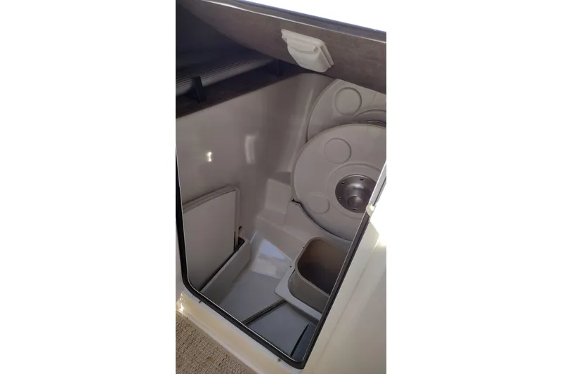 Slide: The Image of Interior storage compartment of 2014 Sea Ray 270 SLX boat, featuring organized space. - 27
