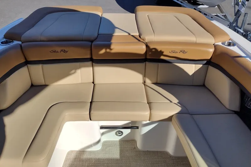 Slide: The Image of 2014 Sea Ray 270 SLX boat interior with tan leather seating and cup holders. - 32
