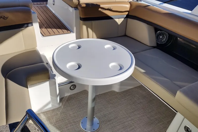 Slide: The Image of 2014 Sea Ray 270 SLX boat interior with round table and cushioned seating. - 35