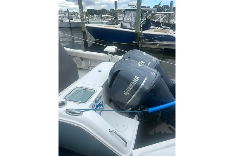 Slide: The Image of 2021 Sea Hunt Gamefish 27 Coffin Box with Yamaha engines docked at marina. - 21