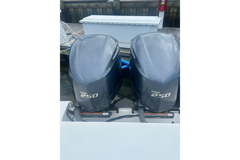 Slide: The Image of 2021 Sea Hunt Gamefish 27 Coffin Box with Yamaha engines docked at marina. - 25