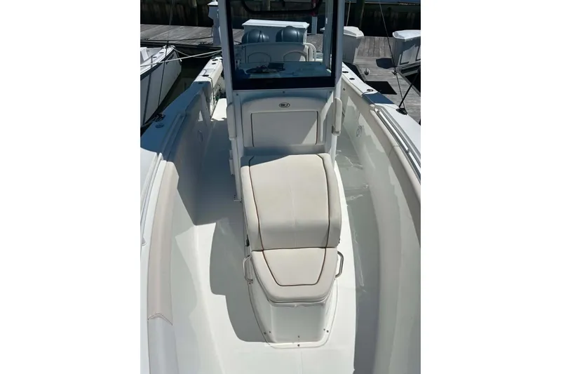 Slide: The Image of 2021 Sea Hunt Gamefish 27 Coffin Box boat interior with seating and console. - 32