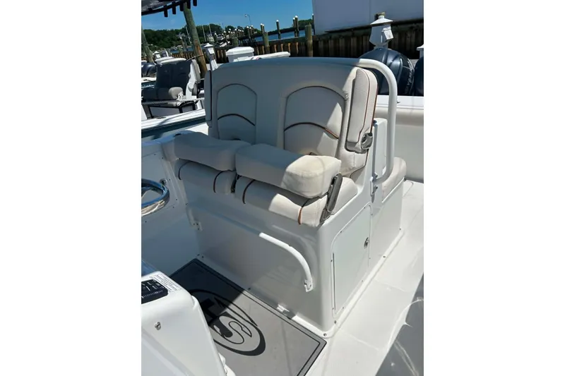 Slide: The Image of 2021 Sea Hunt Gamefish 27 Coffin Box boat seating area with cushioned seats. - 36