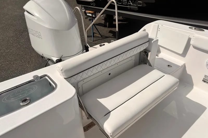 Slide: The Image of 2024 Sportsman Open 242 Center Console boat with white seating and Yamaha engine. - 3