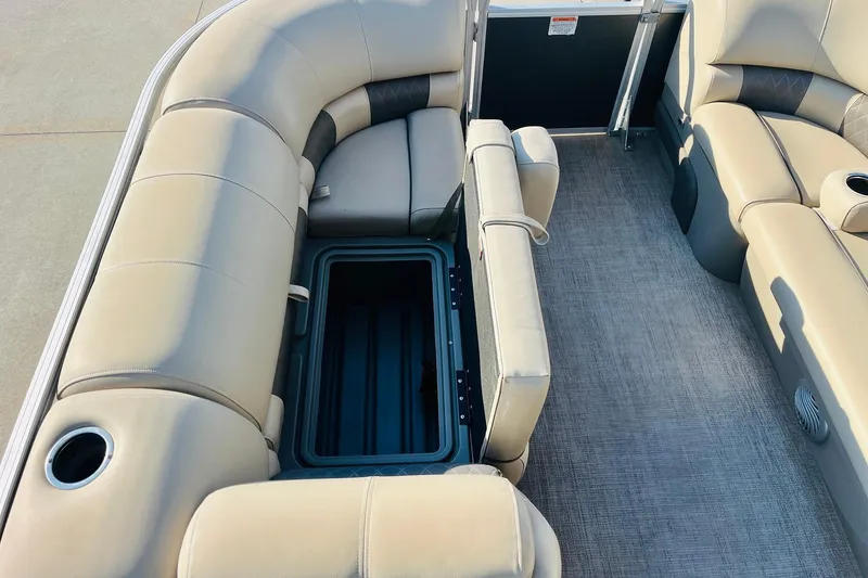 Slide: The Image of 2022 Sun Tracker Party Barge 20 DLX interior with open storage compartment. - 13