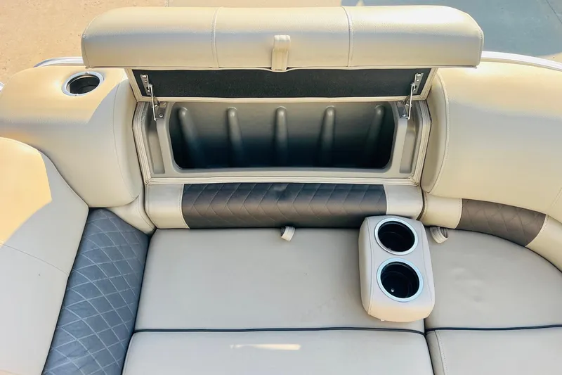 Slide: The Image of 2022 Sun Tracker Party Barge 20 DLX seating with storage and cup holders. - 15