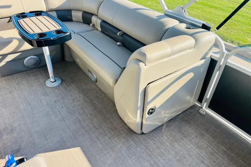 Slide: The Image of 2022 Sun Tracker Party Barge 20 DLX interior with seating and table. - 21