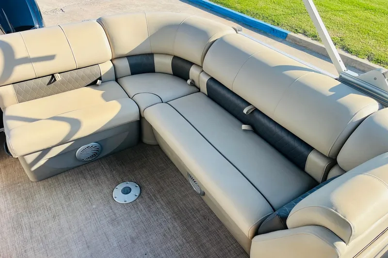 Slide: The Image of 2022 Sun Tracker Party Barge 20 DLX interior seating, beige and black upholstery. - 23