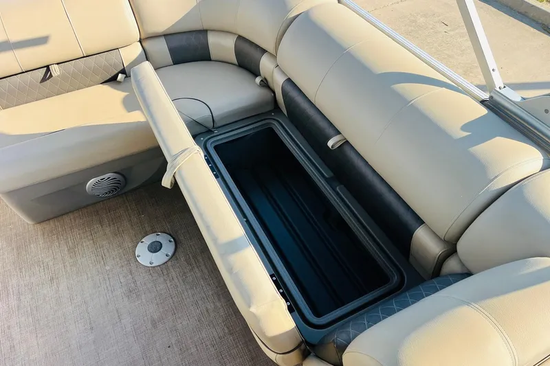 Slide: The Image of 2022 Sun Tracker Party Barge 20 DLX seating with open storage compartment. - 24