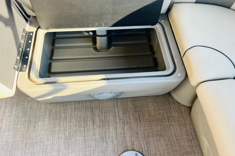 Slide: The Image of Open storage compartment on 2022 Sun Tracker Party Barge 20 DLX boat. - 27