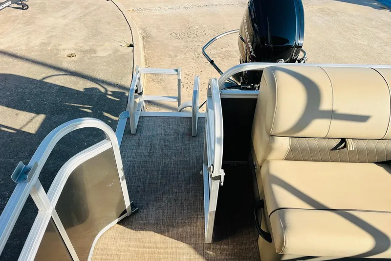 Slide: The Image of 2022 Sun Tracker Party Barge 20 DLX with beige seating and rear entry gate. - 34