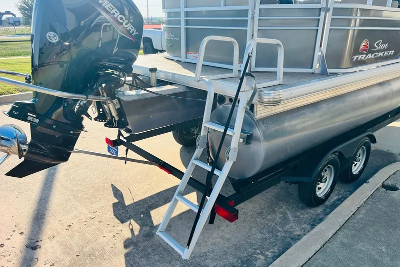 Slide: The Image of 2022 Sun Tracker Party Barge 20 DLX with Mercury outboard motor and trailer. - 7