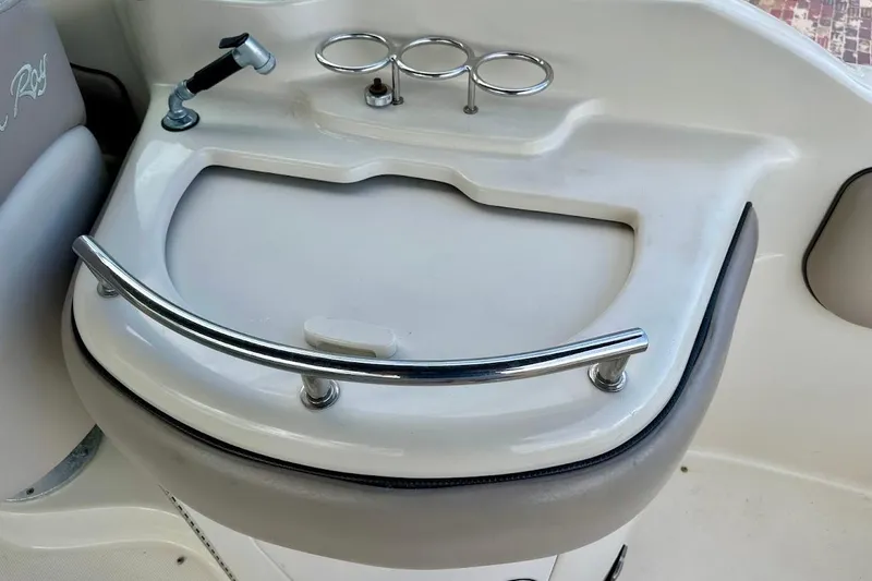 Slide: The Image of 2004 Sea Ray 270 Sundeck boat sink with faucet and cup holders. - 19