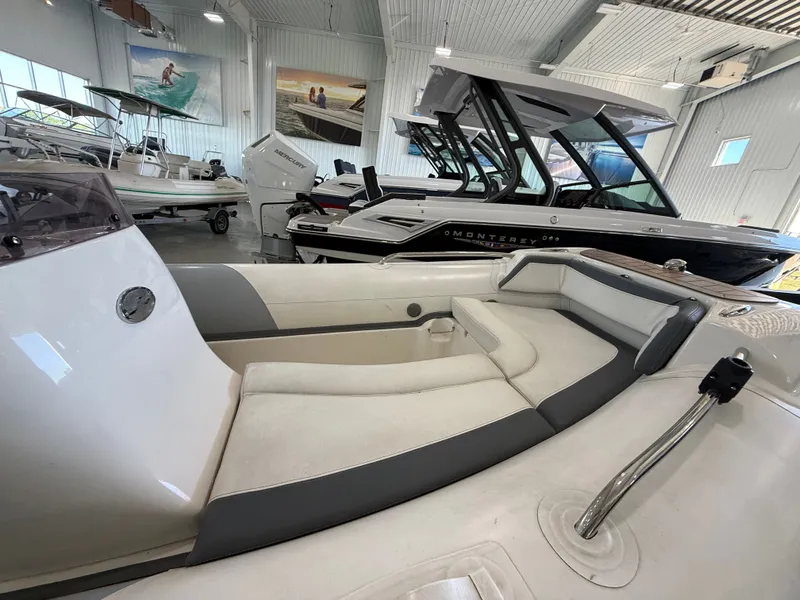 Slide: The Image of 2009 Walker Bay Generation 430 boat interior in showroom, featuring sleek seating and modern design. - 5