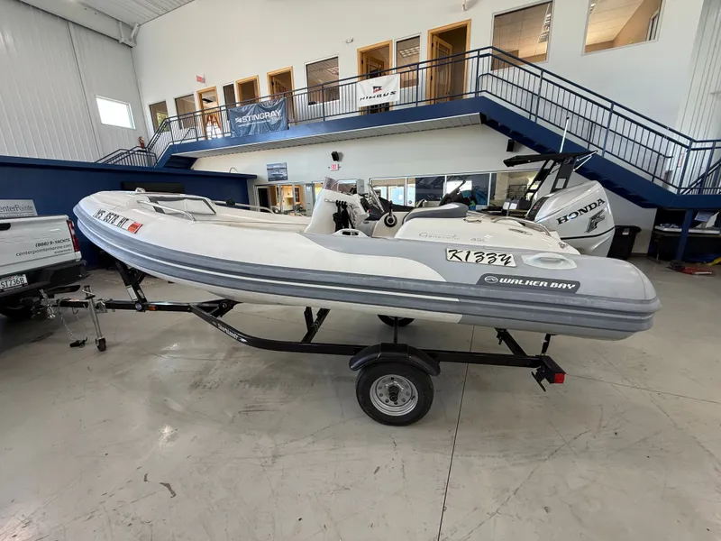 Slide: The Image of 2009 Walker Bay Generation 430 boat on trailer in showroom. - 7