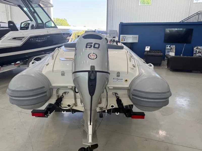 Slide: The Image of 2009 Walker Bay Generation 430 boat with outboard motor in showroom. - 8