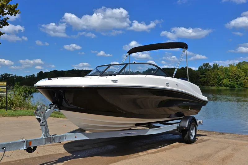 Slide: The Image of 2018 Bayliner VR5 Bowrider OB on trailer by a scenic lake. - 10