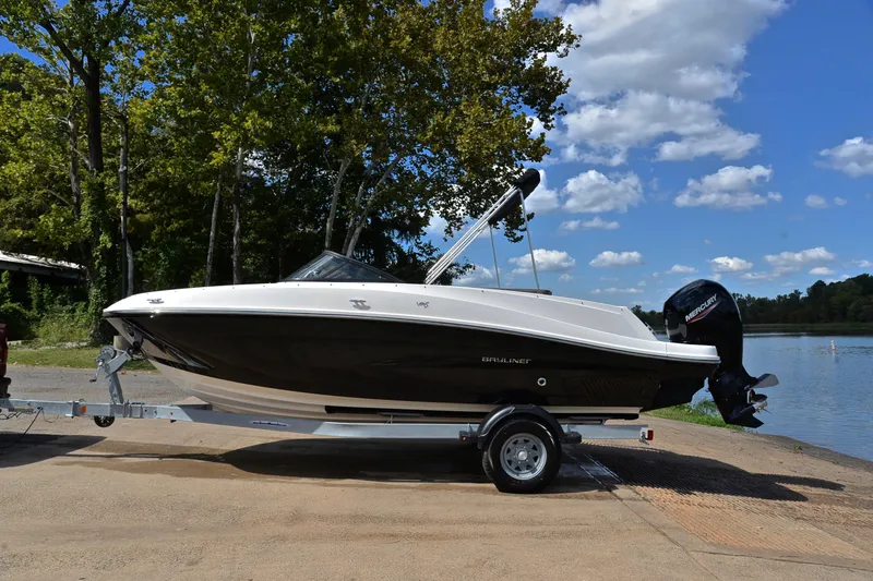 Slide: The Image of 2018 Bayliner VR5 Bowrider OB on trailer by a lake, under clear sky. - 11