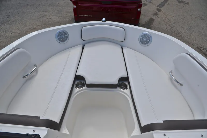 Slide: The Image of 2018 Bayliner VR5 Bowrider OB interior with white seating and cup holders. - 21