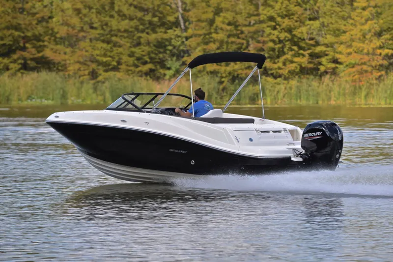 Slide: The Image of 2018 Bayliner VR5 Bowrider OB cruising on a serene lake. - 4