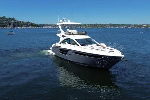 Slide: The Image of 2018 Cruisers Cantius yacht cruising on a sunny lake. - 1