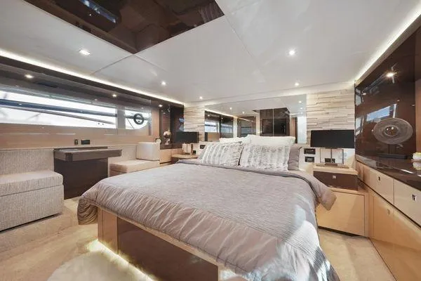 Slide: The Image of Luxurious 2018 Cruisers Cantius yacht bedroom with modern decor and ambient lighting. - 10