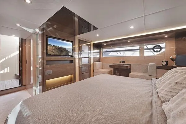 Slide: The Image of Luxurious 2018 Cruisers Cantius yacht bedroom with modern decor and large windows. - 12